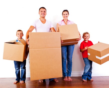 Packed moving boxes and furniture prepared for France removals