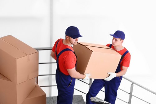 Furniture removals in France with moving truck in a city street