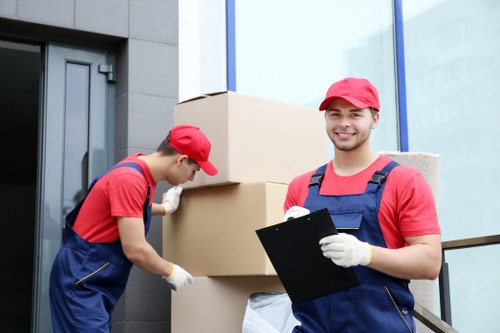 Professional movers handling furniture during removals in France
