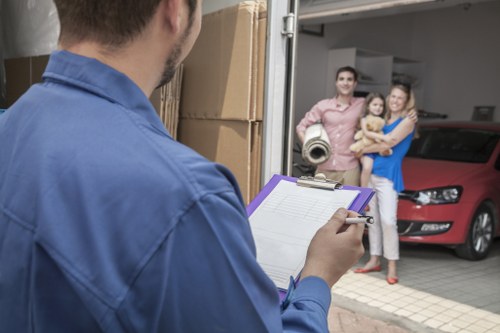 Professional movers handling office equipment during a commercial move in France