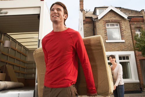 Professional furniture removal team in France loading bulky items