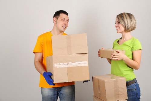 Piano movers navigating stairs during removals in France